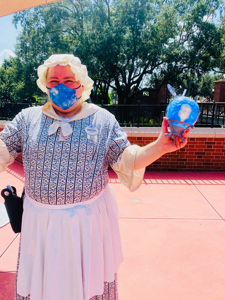 Liberty Square Haunted Mansion Cast Member holding new cup