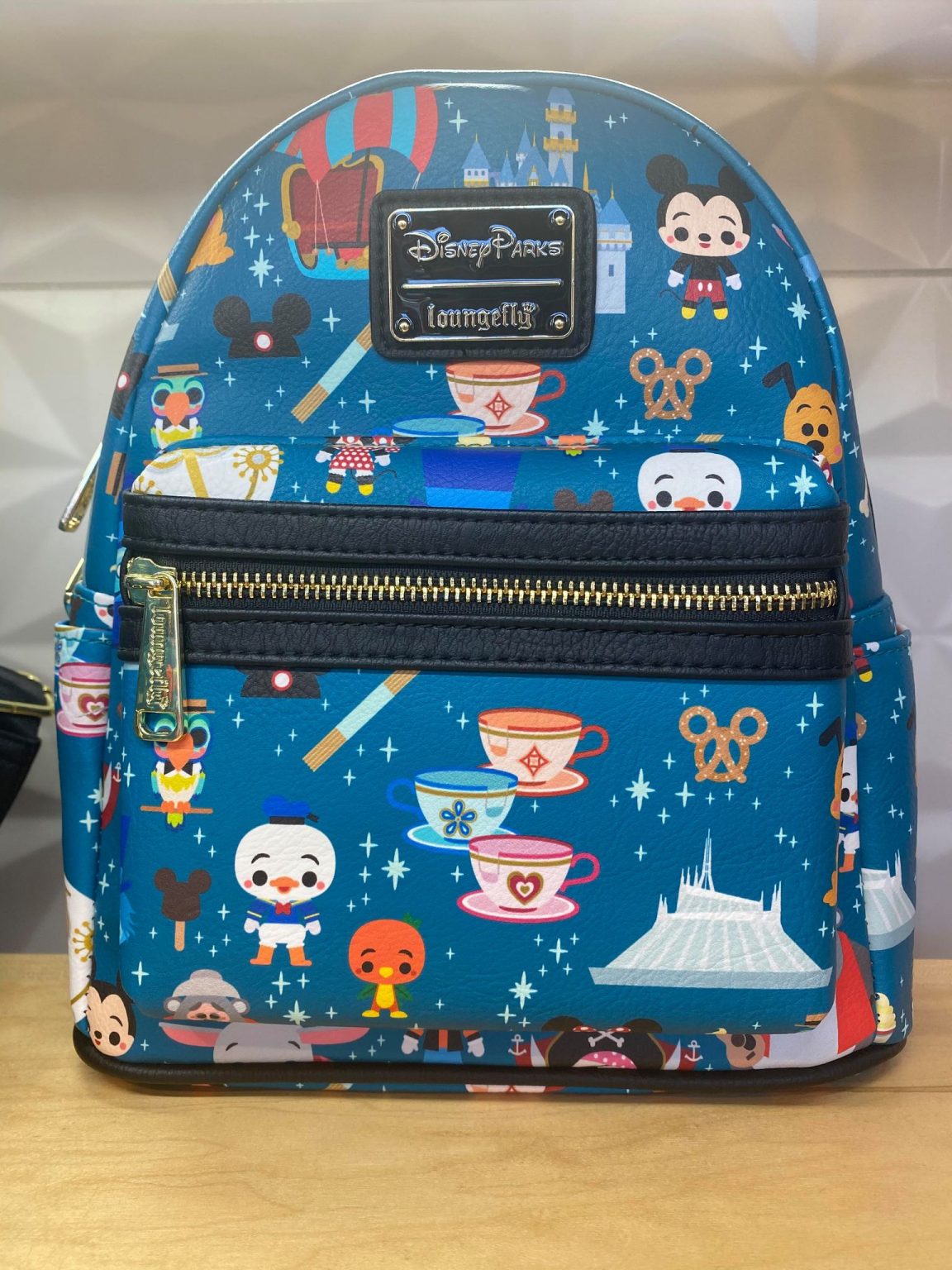 This New Loungefly Mini Backpack Features Magic Kingdom Icons Disney